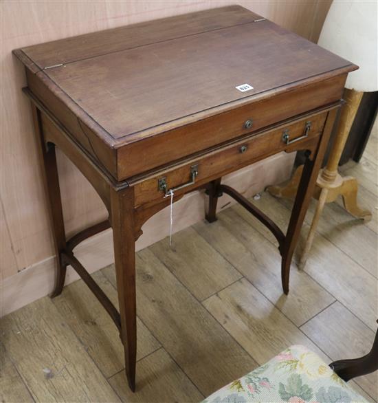 An Edwardian mahogany coaching desk, with partially fitted leather trimmed interior, W.66cm